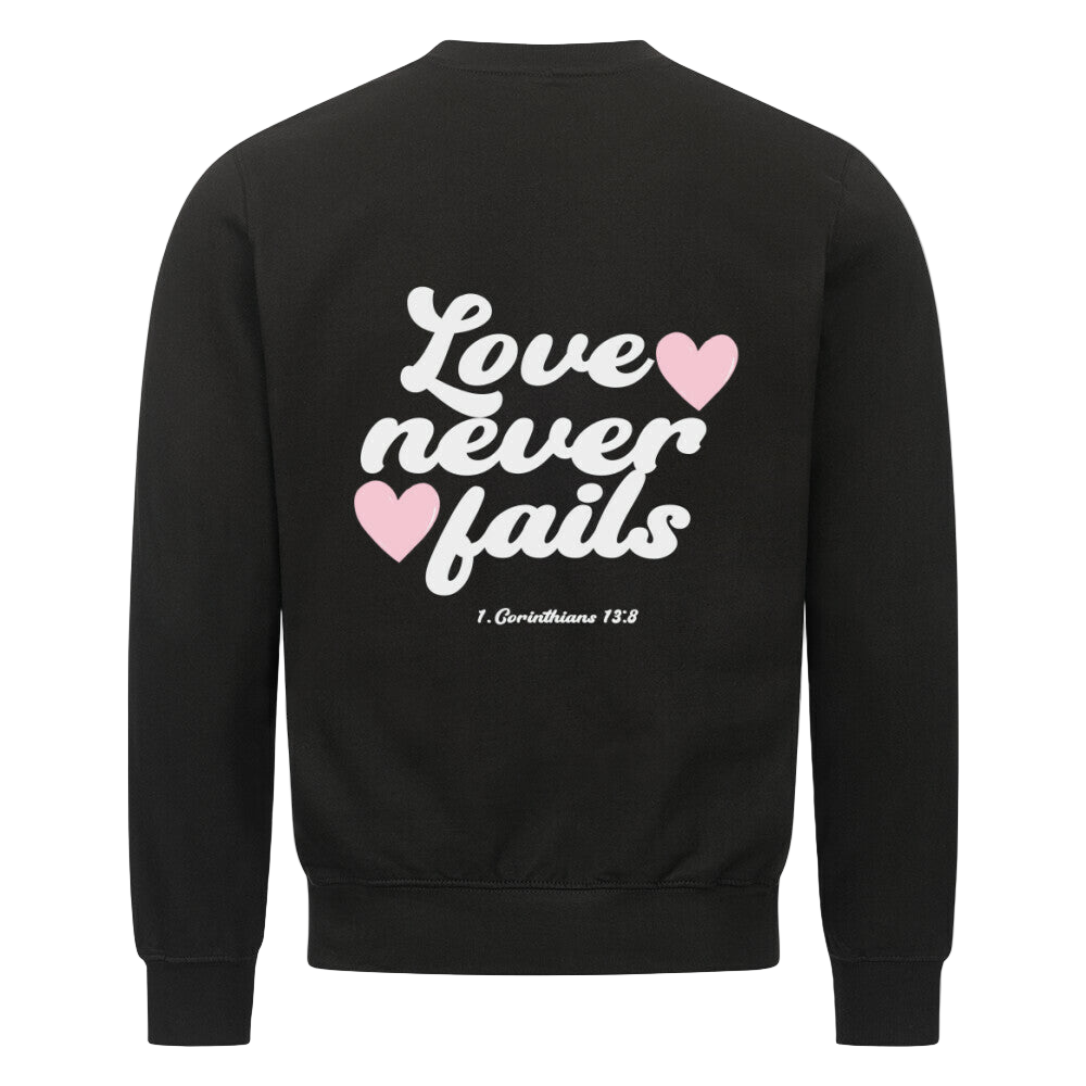 LOVE NEVER FAILS SWEATER